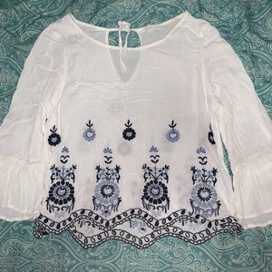White blouse with blue and navy embroidery